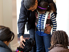 The Obamas welcoming their new dog