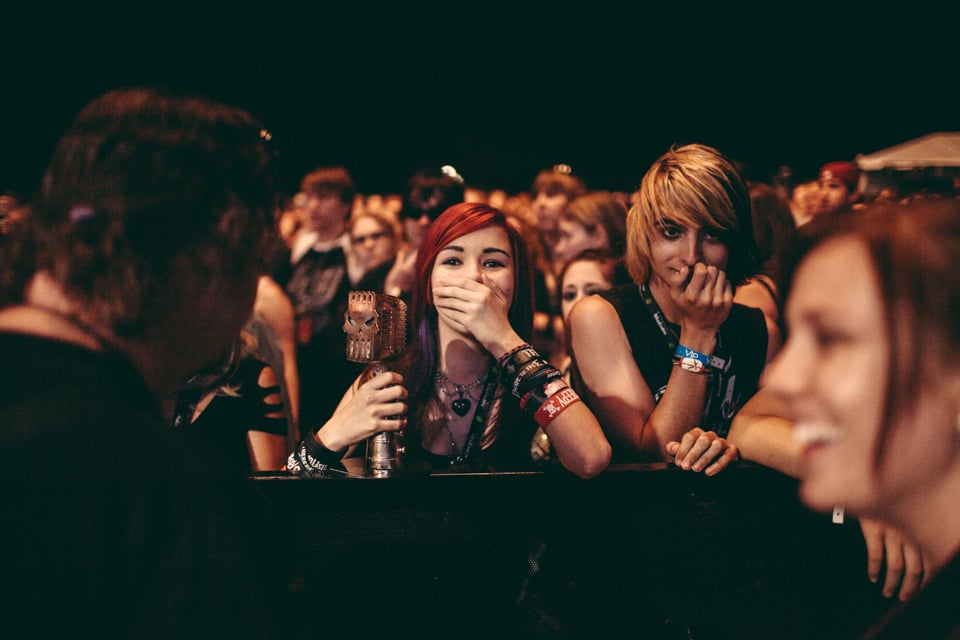 A Black Veil Brides fan in the crowd with the bands' Most Dedicated Fans award