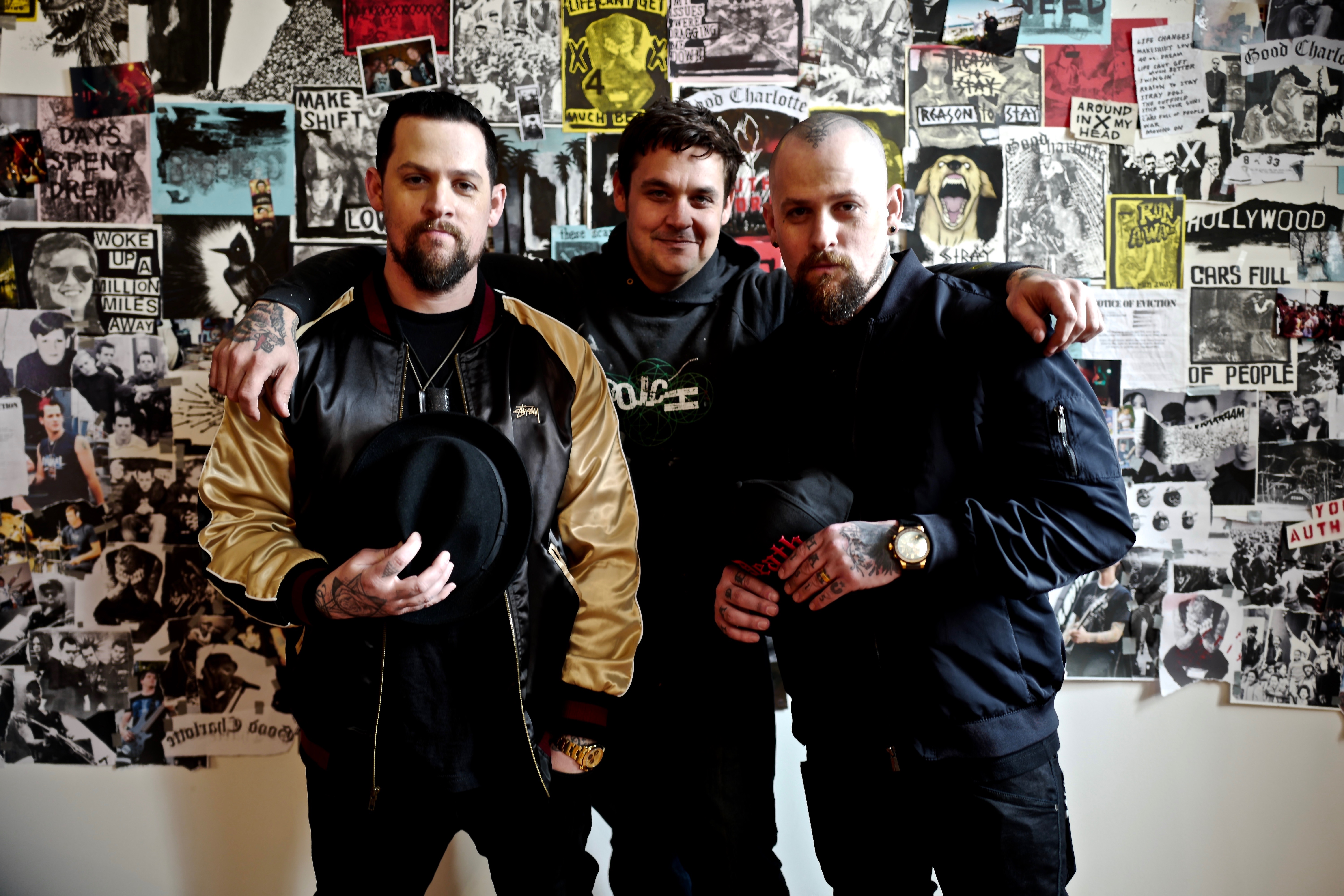 Joel and Benji Madden of Good Charlotte with Brian Montouri, the artist behind Youth Authority's album cover